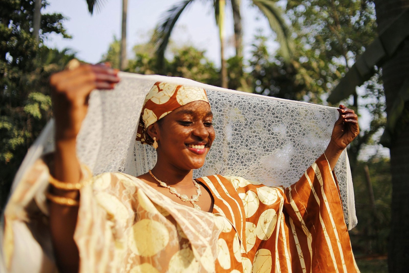 Woman smiling outdoors, representing inclusive and culturally responsive psychotherapy